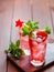 Sparkling pink strawberry lemonade on dark wooden background