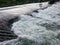 The sparkling turbulent water of the river Vrbas, rapid water movement, power of nature