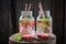 Sparkling water in jar with pomegranate and watermelon