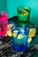 Sparkling water, soda or a gin and tonic in colorful glasses with lemon and ice