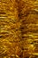 Sparkling yellow tinsel for a Christmas tree