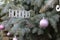 Sparkly Holiday tree decorations spell hohoho