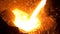 Sparks on black background from the process of pouring hot steel, heavy industry. Stock footage. Close up for iquid