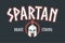 Spartan helmet t-shirt design with slogan and meander frame. Typography graphics for tee shirt with Sparta warrior armor helmet.