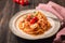 Spashetti pasta with tomato sauce and baked tomatoes cherry