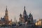 Spasskaya tower with watch of Moscow Kremlin architectural ensemble and Saint Basil`s Cathedral at night