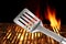 Spatula Close Up And Barbecue Flaming Grill On The Background