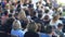 Speaker giving a talk in conference hall at business event. Audience at the conference hall.