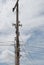 Speakers on electric pole with a blue sky background