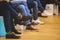 Speakers shoes at the business conference event, audience at the lecture hall listens to lecturer, persons on a stage at master-