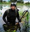 Spearfishing. A man in a wetsuit with a fish caught