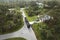 Special aftermath recovery dump truck picking up vegetation debris from suburban streets after hurricane Ian swept