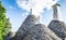 Special conical roofs of the trulli in cisternino on the blue background of the sky.