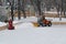 Special machine and worker clean the ice skating rink in Park Gorkogo in Moscow