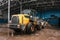 Special machinery or bulldozer work on the site of waste unloading at the plant for waste disposal.