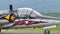 Special painted military vintage jet aircraft close view taxiing on the runway