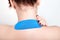 Special physio tape on back of young woman