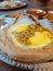 Special roti sarang burung with redang gravy on the eggs. It is pratha looks like bird nest with half cook eggs in the middle