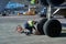 A specialist aircraft mechanic conducts preparatory work before takeoff of an air passenger ship at the parking lot