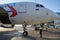 A specialist aircraft mechanic conducts preparatory work before takeoff of an air passenger ship at the parking lot