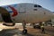 A specialist aircraft mechanic conducts preparatory work before takeoff of an air passenger ship at the parking lot