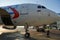 A specialist aircraft mechanic conducts preparatory work before takeoff of an air passenger ship at the parking lot