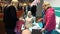 Specialist physician demonstrates the modern mannequins for first aid skills. Exhibition of medical equipment and
