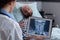 Specialist physician woman examining bones radiography using tablet computer