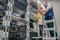 The specialist works in the server room of the data center. Worker lays communication cables. Technological concept. Technician