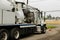 A specialized sewer cleaning machine works on a street