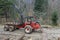 Specialized tractor forwarder folding wood in the forest. The Carpathians, Poland