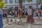Spectacle view with street theater, medieval fair, actors dressed in typical costumes, walking geese and public watching