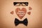 Spectacles, bowtie and wooden heart with note Happy Fathers Day, cork board background, top view, flat lay
