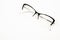 Spectacles isolated on a white background, forging glasses lenses in a white frame, women`s and men`s accessories. Optics  look go