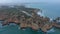 Spectacular aerial drone view of Lagos, Portugal coast ocean with lighthouse and townscape on background, day, circle