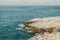 Spectacular aerial view on the rocks in the sea with horizon on the background