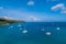 Spectacular aerial view of some yachts and small boats floating on a clear and turquoise sea, Seychelles in the Indian Ocean.Top