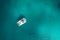 Spectacular aerial view of yacht floating on a clear and turquo