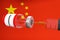 Spectacular bottle of fentanyl citrate levitating in the air with a penetrating syringe against a CHINA FLAG\\\'S