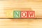 Spectacular colorful letters on wooden cubes on a wooden board with the word KNOW