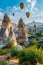 Spectacular display of vibrant hot air balloons drifting over majestic mountain scenery