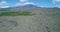 Spectacular drone aerial reveal of active volcano Etna in the beautiful island of Sicily. Clouds cover the top of