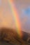 Spectacular, fiery rainbowat  sunset over the west maui mountains