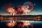 A spectacular fireworks display by the seaside reflecting in the water