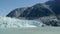 Spectacular glacier calving. Ice cubes fell into the water like an explosion.