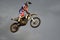 The spectacular jump moto racer on a motorcycle