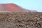 Spectacular landscape of lava fields and red volcano, Lanzarote, Spain