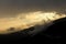 Spectacular light during sunset in the mountains. Dramatic cloud