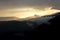 Spectacular light during sunset in the mountains. Dramatic cloud