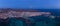 Spectacular mid level panoramic aerial view of the setting moon early morning over Corralejo Fuerteventura